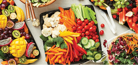 Fresh fruit, vegetable and salad trays arranged for summer entertaining.